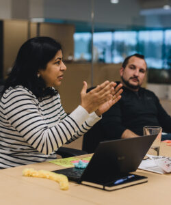 Woman explaining data analytics in a meeting